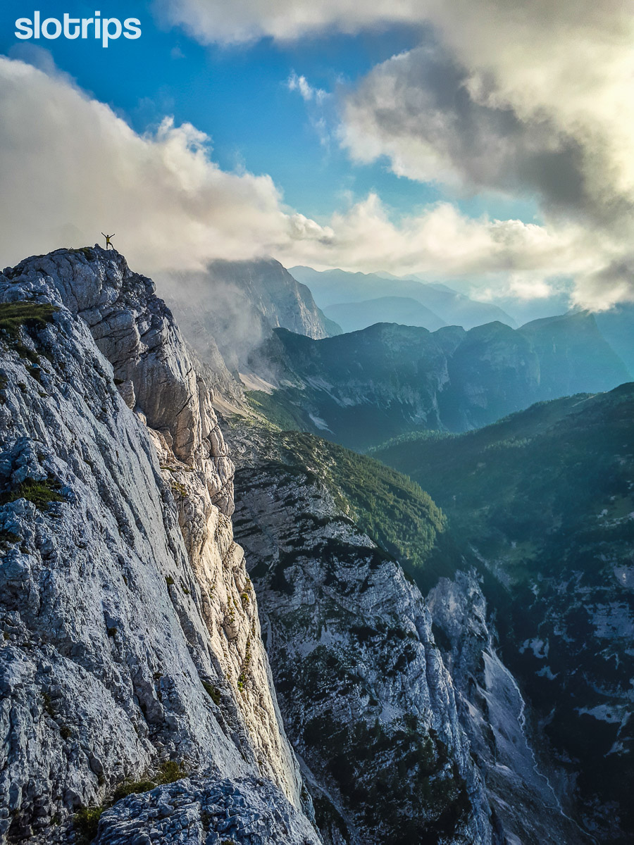 Hiking on the edge of a cliff in the Julian Alps, Slovenia