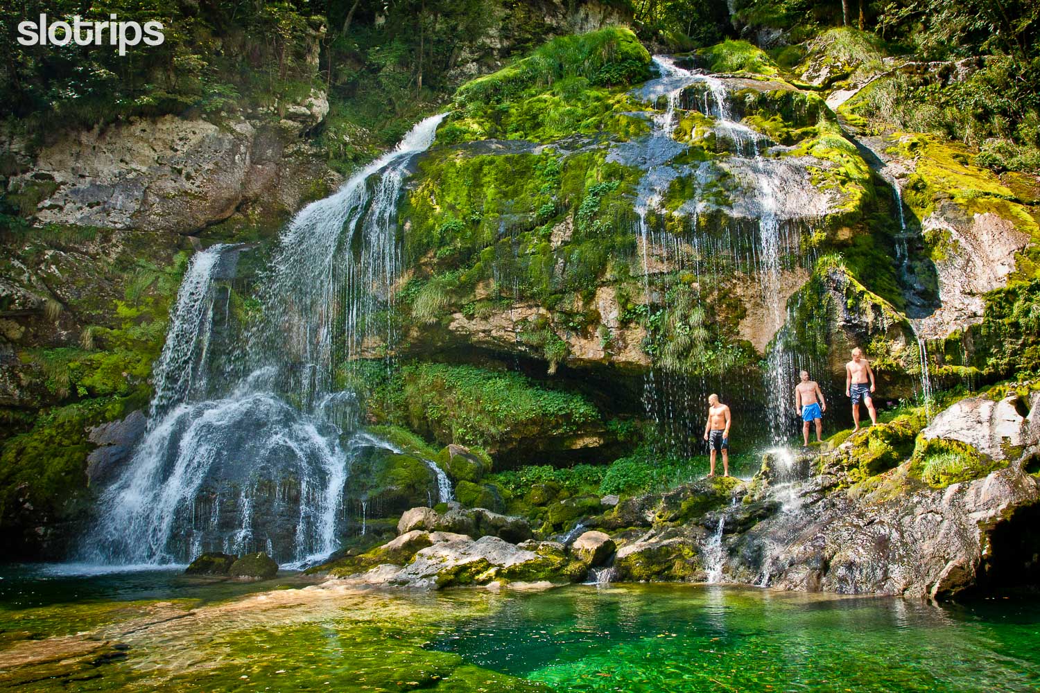 Swimming in virje waterfall in the Soca valley, Slovenia