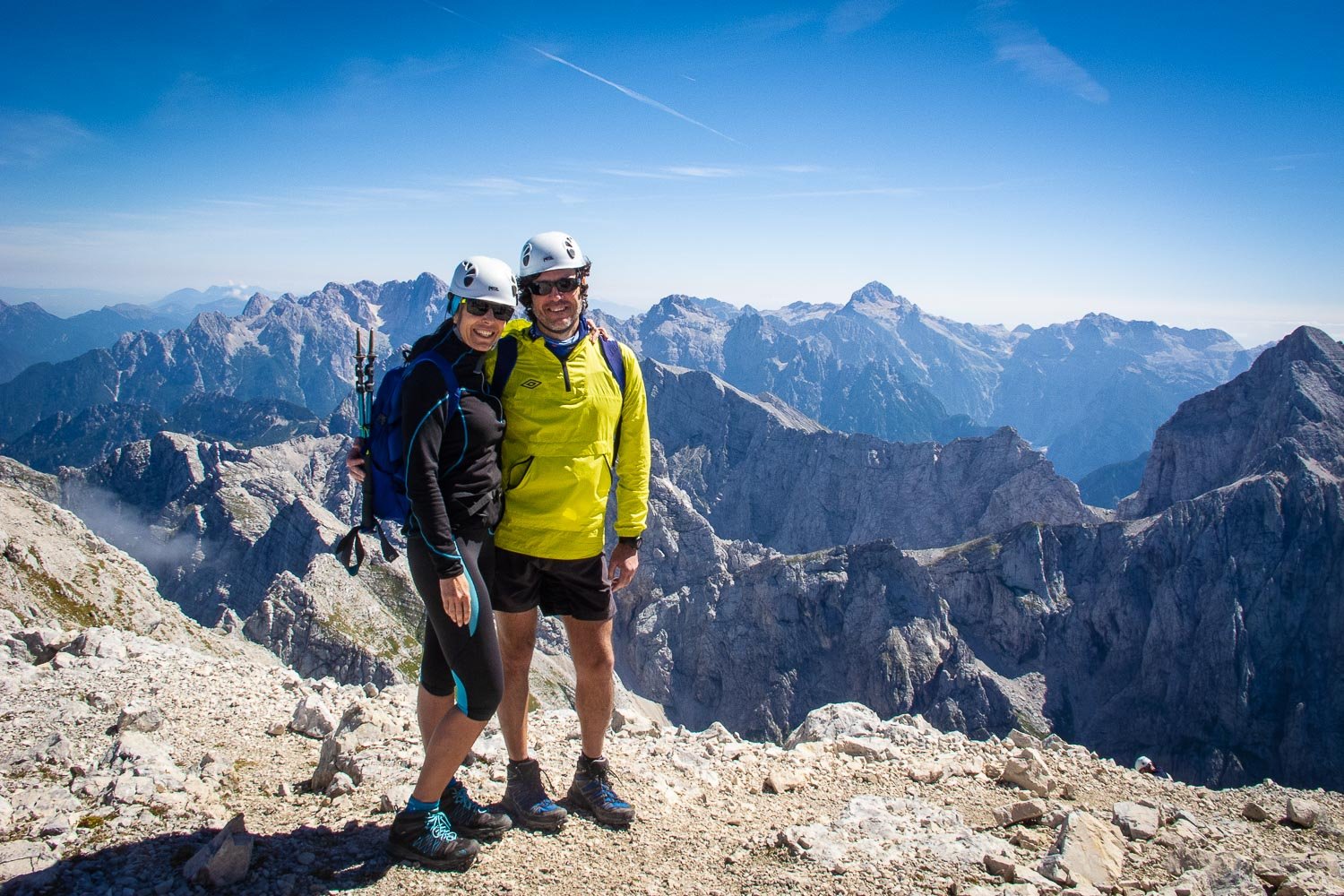 Hikers on top of Mt. Mangart on a hiking trip in Slovenia