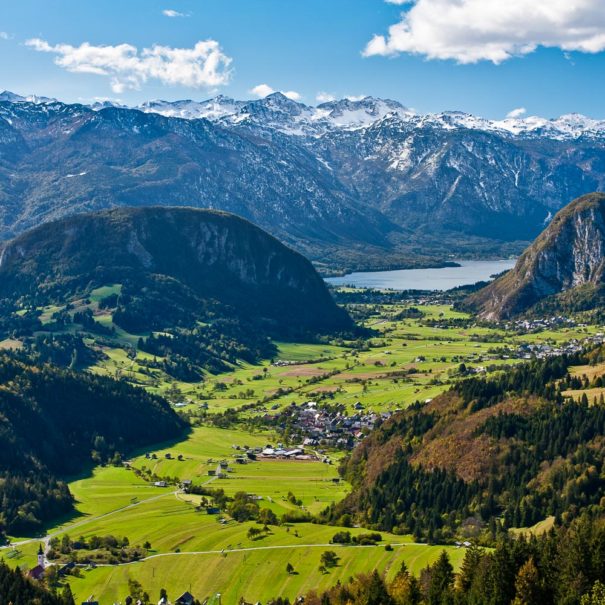 Hiking trip lookout of the spectacular Lake Bohinj with the Bohinj mountains and alpine villages.
