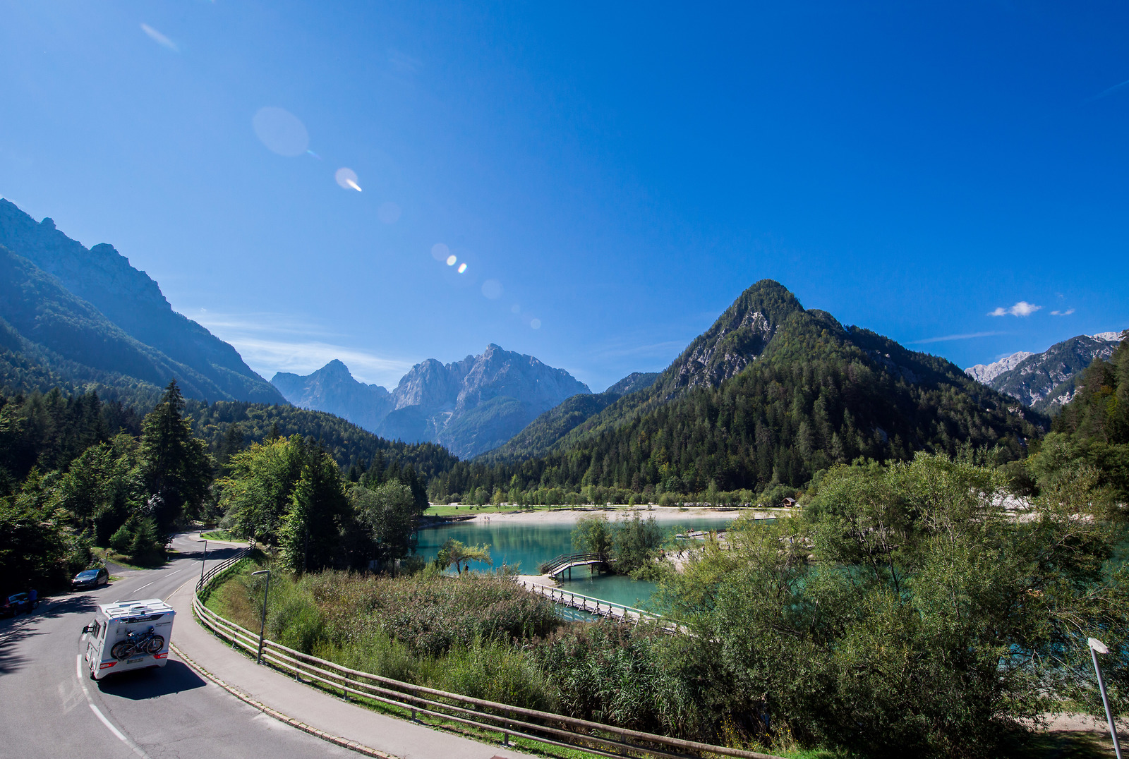 Travellers on adventure holidays in Slovenia explore the Julian Alps with lake Jasna by car.