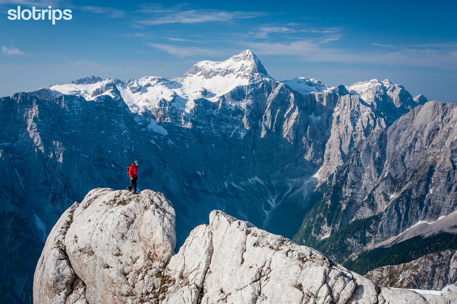 Hiker on a narrow ridge in Triglav National Park, Julian Alps