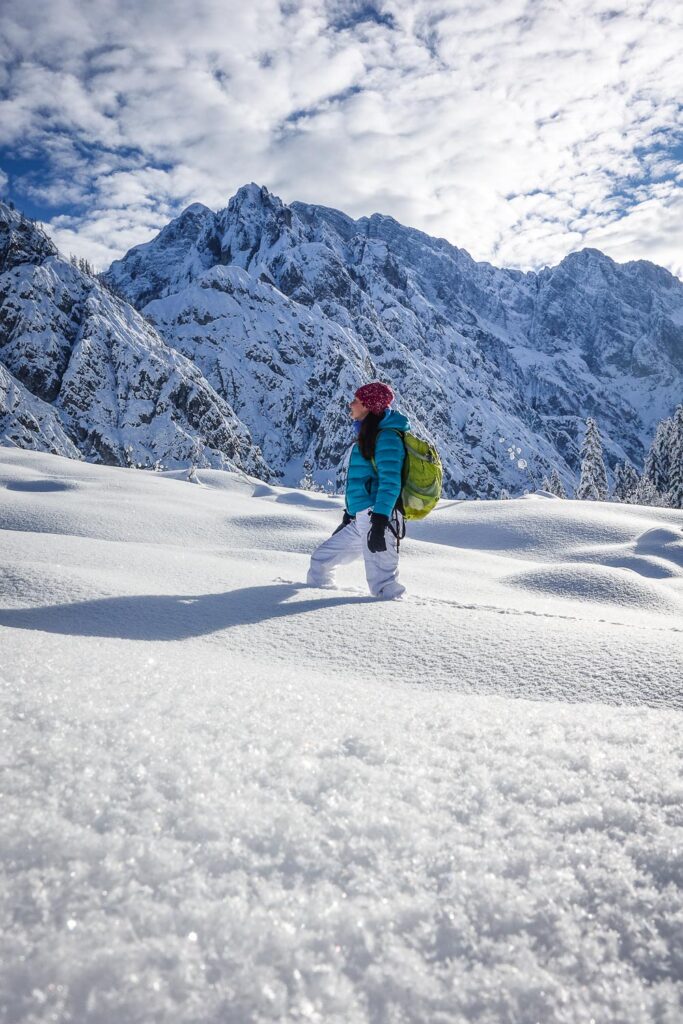 Hiker in deep snow on a tour in the Julian Alps, Slovenia