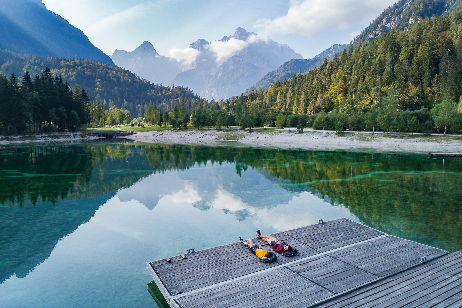 Hikers taking a rest at Lake Jasna, Slovenia