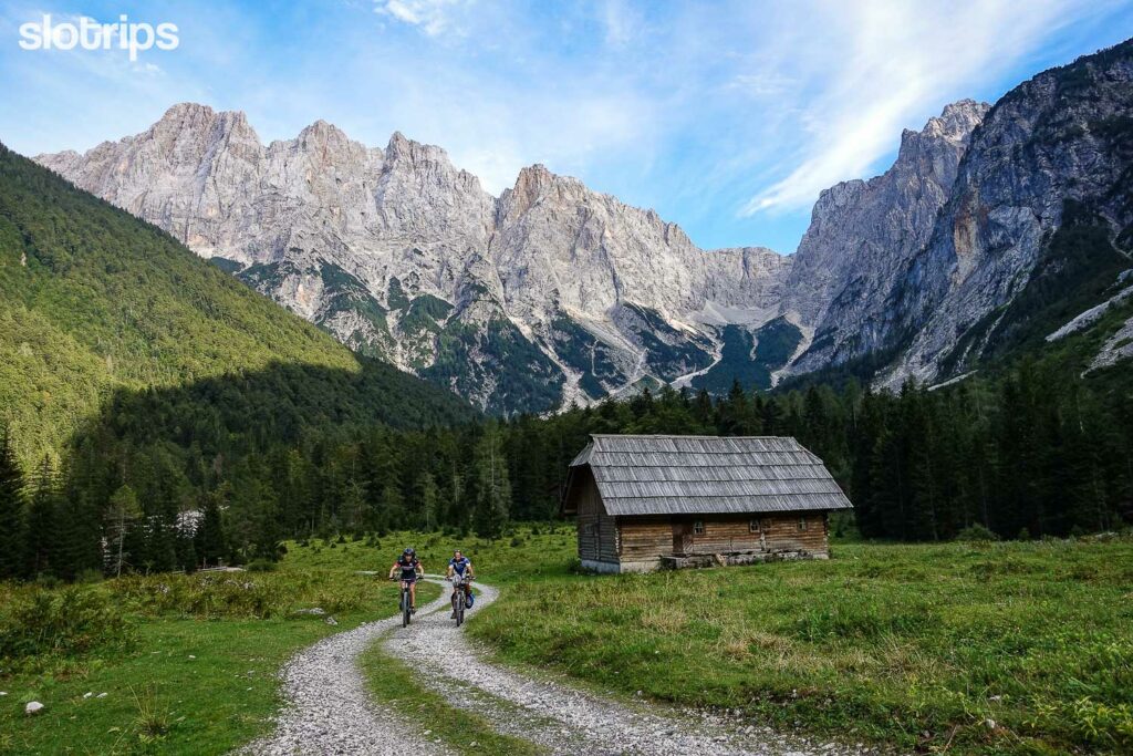 Mountain biking towards Vrsic pass with the Julian Alps in the background