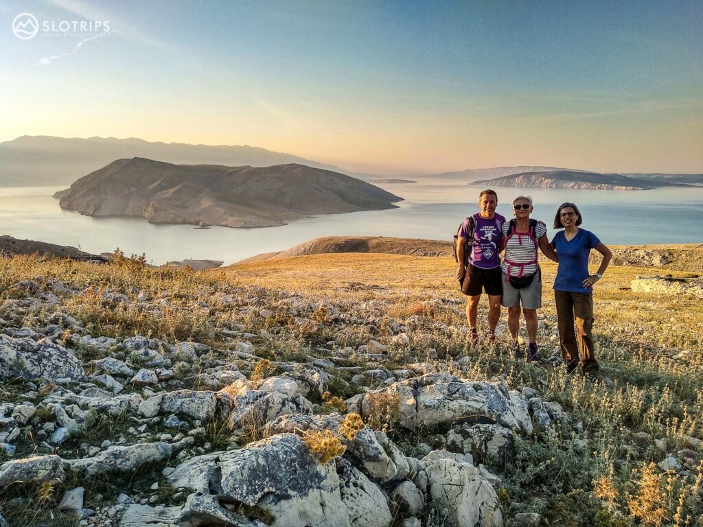 Happy hikers at sunrise on Krk island, Croatia