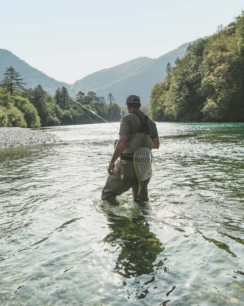 Fly fisher in the Soca river, Slovenia